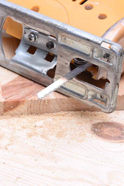 istock Electric jigsaw with wooden bricks 613024148