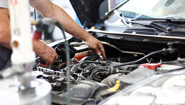 istock Car mechanic repair engine 613025916