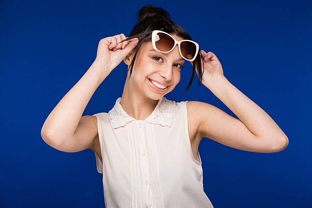 istock girl in sunglasses 613026126