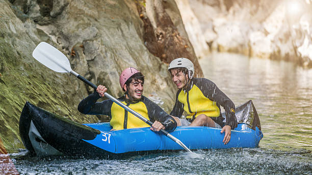 istock Two men in  life jackets on a rafting 613026544