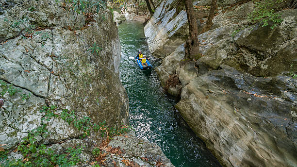 istock Two men in  life jackets on a rafting 613027108