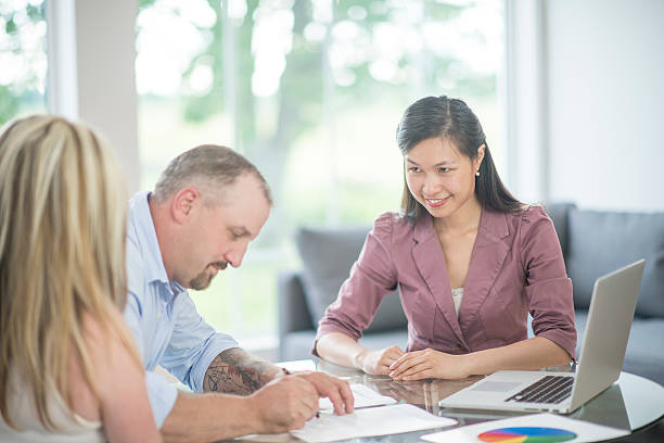 istock Signing for a New Loan 613027736