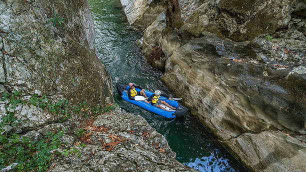 istock Two men in  life jackets on a rafting 613028120
