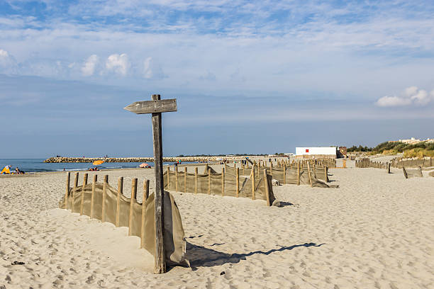 istock beautiful beach and blue sky with clouds 613028176