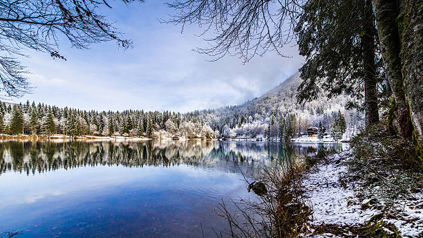 istock first snow at the mountain lake 613029518
