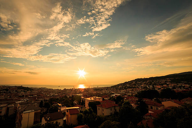 istock sunset on the city of Trieste 613029622