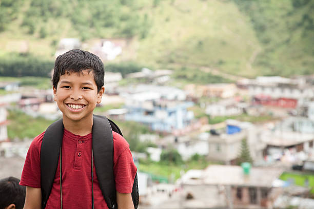istock Happy, Asian descent boy outdoors in Indian city. 613030638