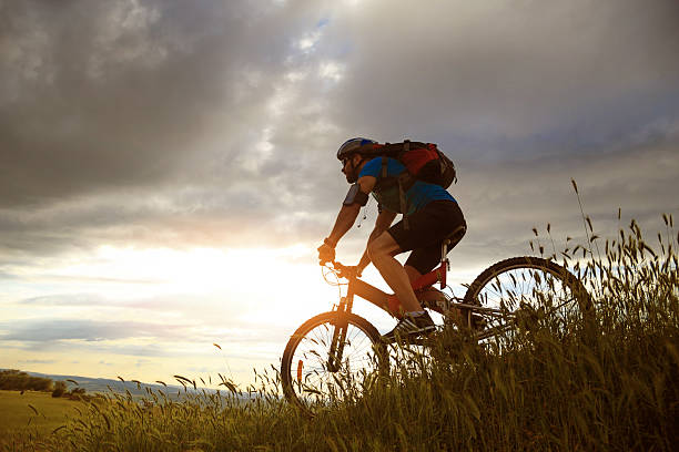 istock Side view of biker moving up on the mountain 613030810
