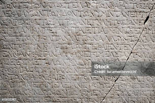 Ancient Greek Engraved Writing On A Marble Stone Stock Photo - Download Image Now - Classical Greek, Greece, Greek Culture