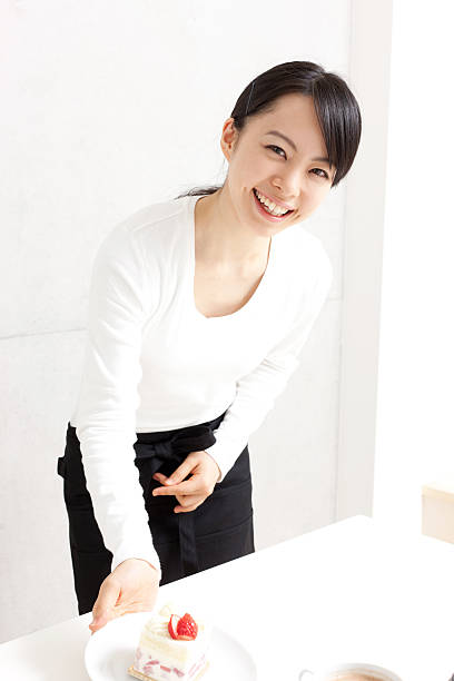 Japanese woman holding a shortcake