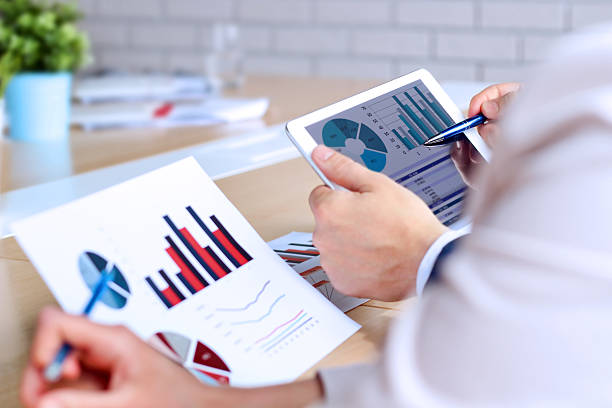 istock Business colleagues working together and analyzing financial figures 613032426
