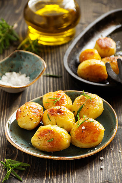 istock Baked potatoes with rosemary. 613033806
