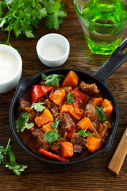 istock Braised beef with pumpkin in red wine. 613034224
