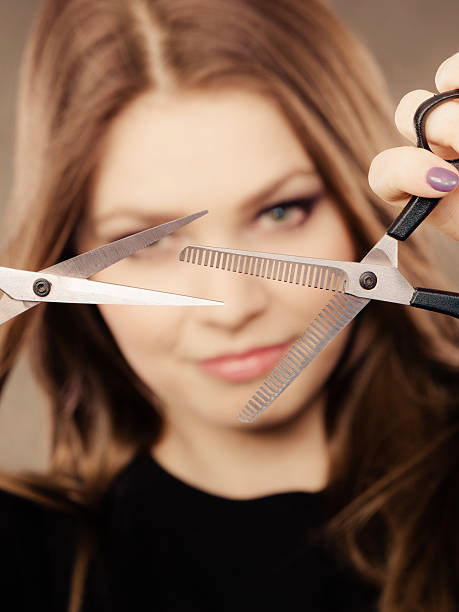 istock Professional hairdresser with scissors ready to cut. 613034868