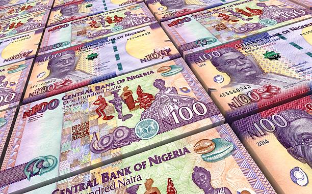 istock Nigerian nairas bills stacks background. 613036278