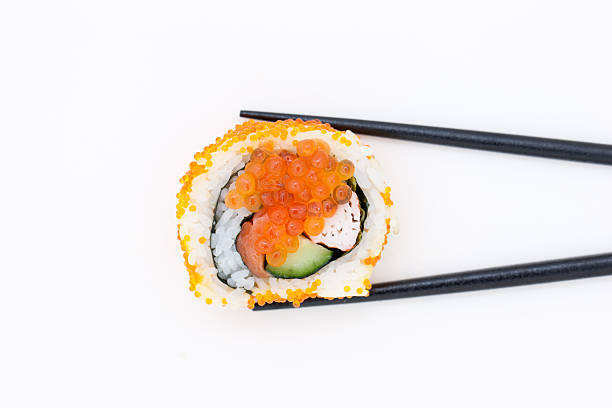 istock Maki sushi with chopsticks 613036660