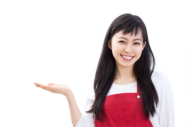 istock Japanese woman wearing an apron making gestures 613037898