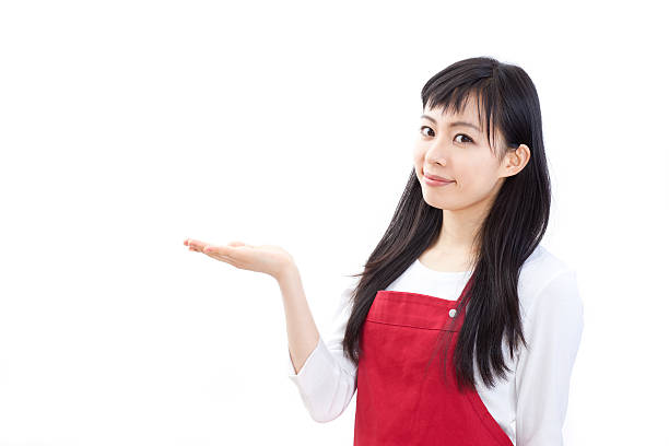 istock Japanese woman wearing an apron making gestures 613037906