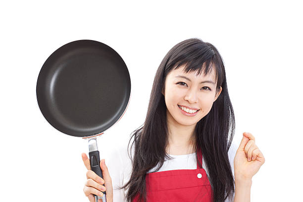 istock Japanese woman holding a pan 613037968