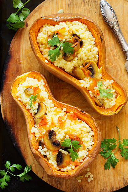 istock Pumpkin stuffed with couscous with grilled mushrooms. 613037986