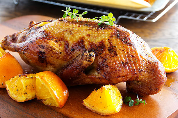 istock Roast duck with pumpkin and oranges. 613038756