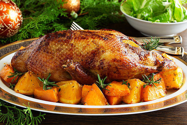 istock Roast duck with pumpkin and oranges. 613038850