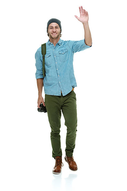 istock Smiling photographer waving hand 613040130