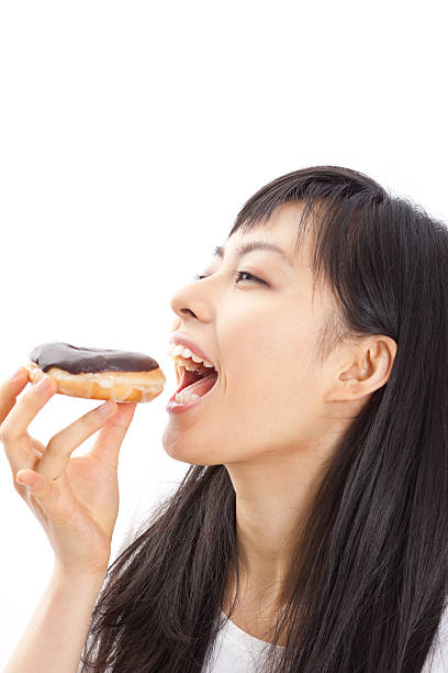 Japanese woman holding a donut