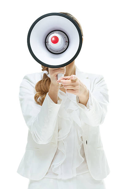 istock Businesswoman shouting with megaphone 613041524