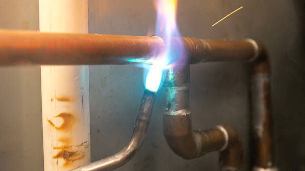 istock Soldering Copper Water Pipe in Residence 613041538