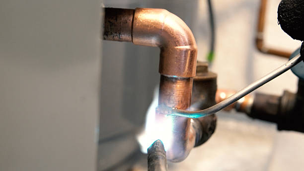 istock Soldering Copper Water Pipe in Residence 613041546
