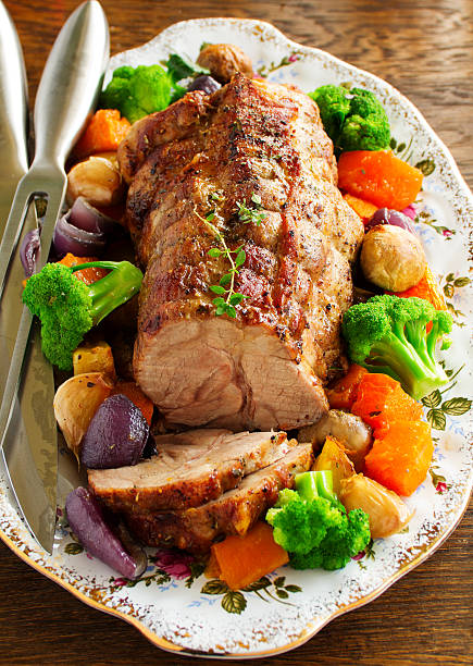 istock Roast pork with vegetables and spices. 613041618