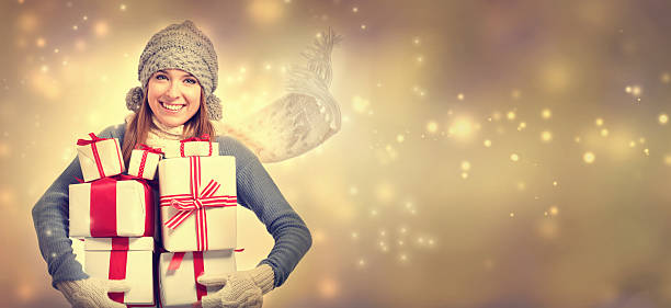 istock Happy young woman holding many present boxes 613041932