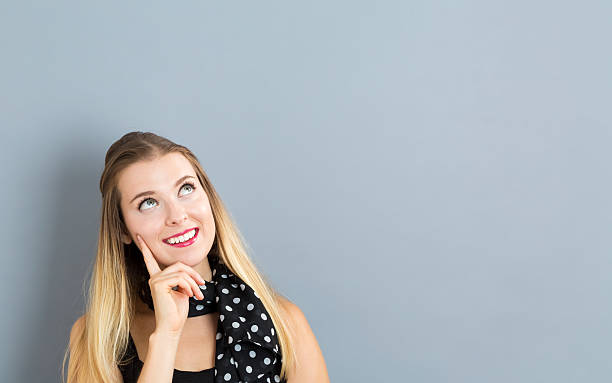 istock Young woman in a thoughtful pose 613042294