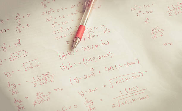 istock red pen on advanced mathematics (maths) in vintage style 613043318