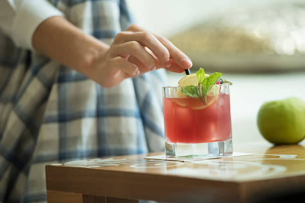 istock Woman with cocktail 613043782