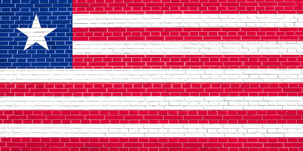 istock Flag of Liberia on brick wall texture background 613043956