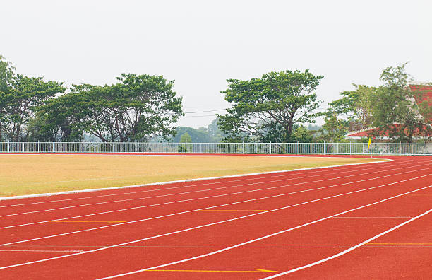 istock track running, red treadmill for athletics and competition. 613045772