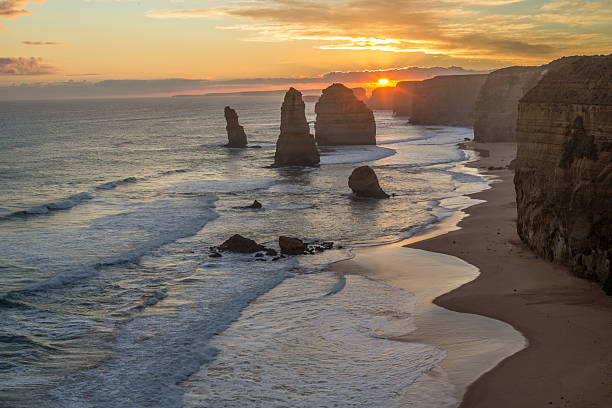 istock Twelve Apostles sea rocks at sunset 613045780
