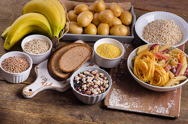 istock Foods high in carbohydrate on rustic wooden background. 613046932