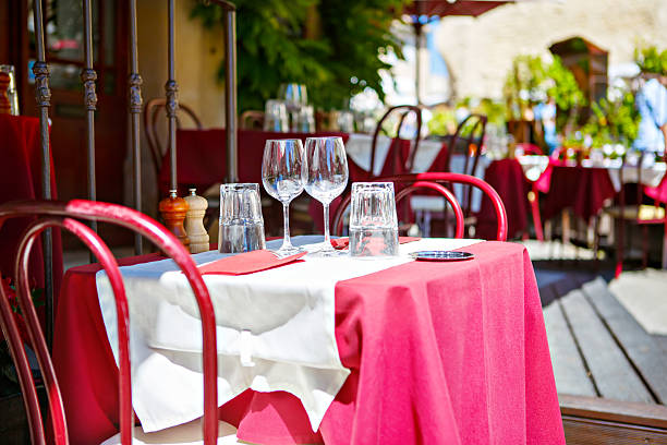 istock Street view of a cafe terrace with empty tables 613048328