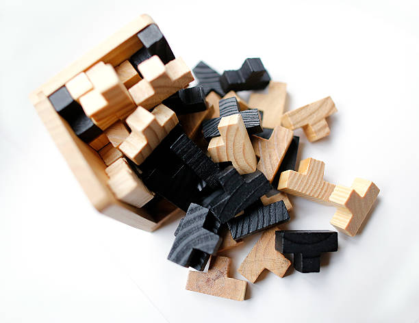 istock Wooden 3D puzzle blocks on white background 613048518
