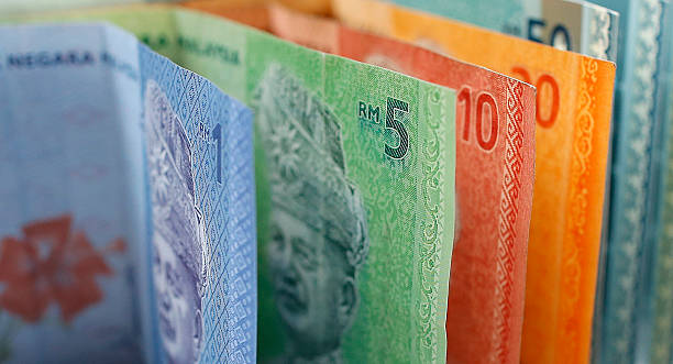 Malaysian ringgit currency on white background Malaysian ringgit currency on white background with nice shadow coins of ringgit of malaysia stock pictures, royalty-free photos & images