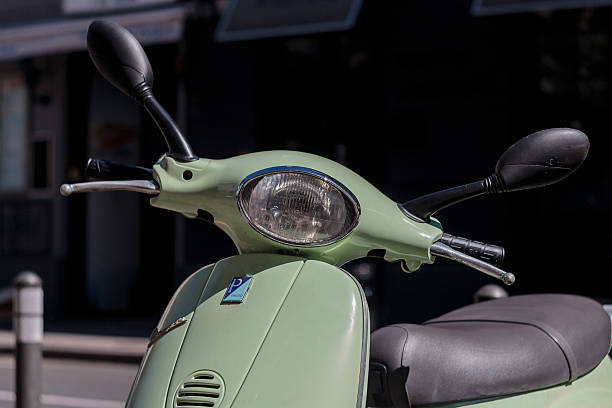 green  italian designed vespa scooter - vespa scooter imagens e fotografias de stock