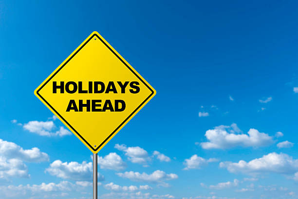 istock HOLIDAYS AHEAD - Road sign 613053010