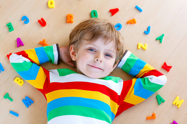 istock Kid boy with colorful numbers, indoor 613055892