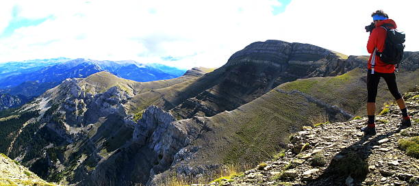 istock Climber taking a panoramic picture of an alpine landscape 613056078