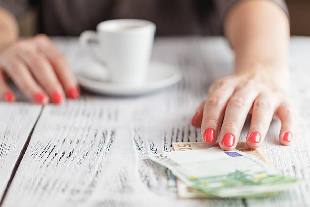 istock woman ready to pay empty finished cappuccino coffee cup 613056184