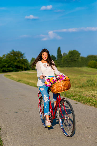 istock Young girl rides a bicycle 613057936