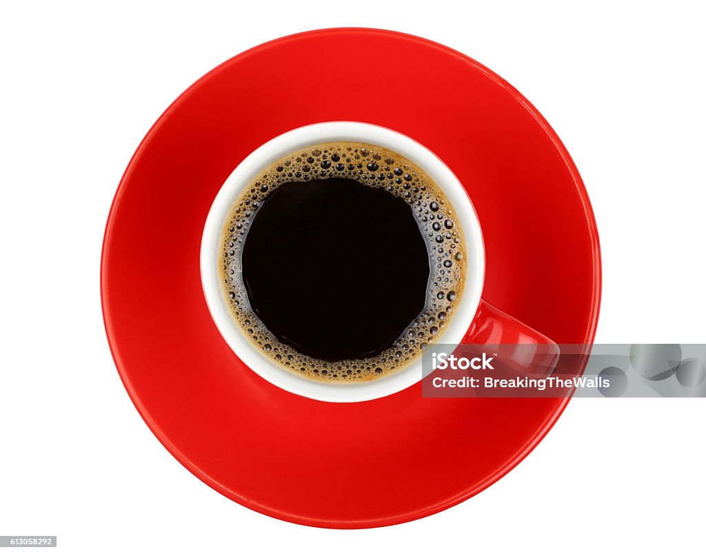 Americano coffee in red cup isolated on white One full morning Americano black coffee with froth edge in small red cup with saucer isolated on white background, top view Red Stock Photo